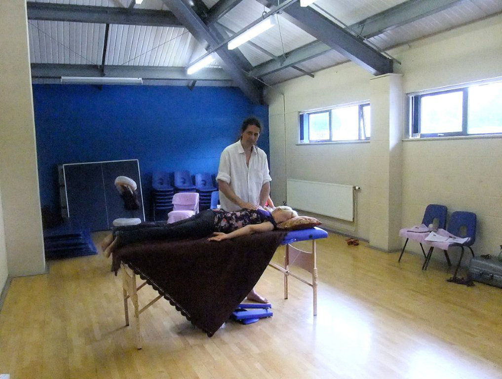 Giving a treatment during a workshop